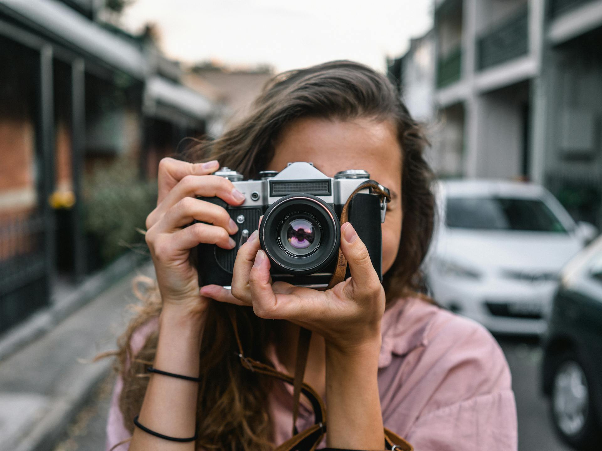 Photo of a woman holding a camera