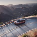 SUV Driving with scenic mountain view.
